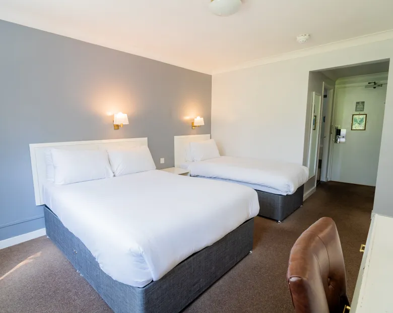 Room with two double beds at Sporting Lodge Inns Middlesbrough