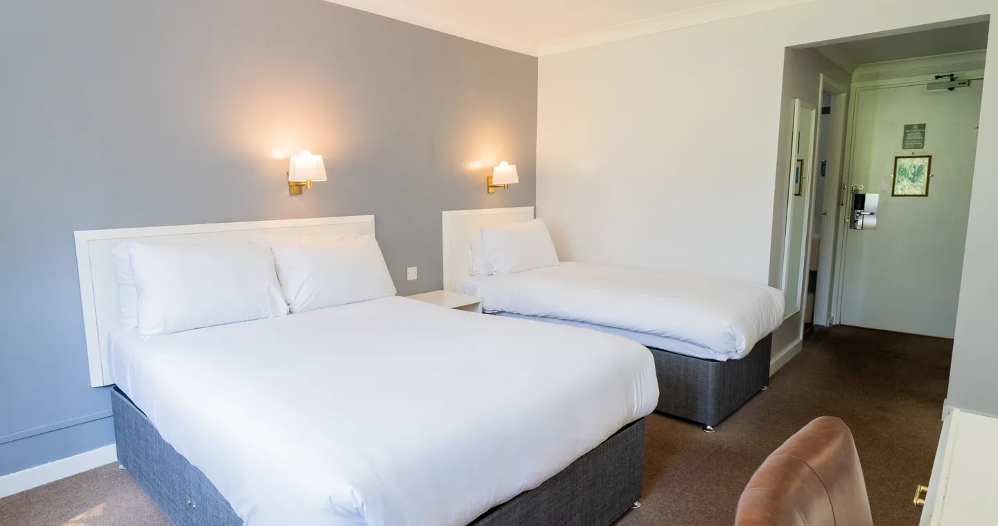 Room with two double beds at Sporting Lodge Inns Middlesbrough
