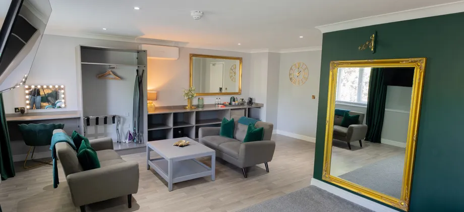 A suite bedroom at Sporting Lodge Inns