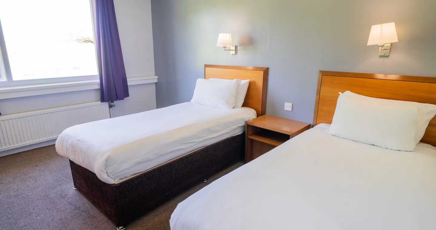 Twin bedroom with two single beds at Sporting Lodge Inns Middlesbrough