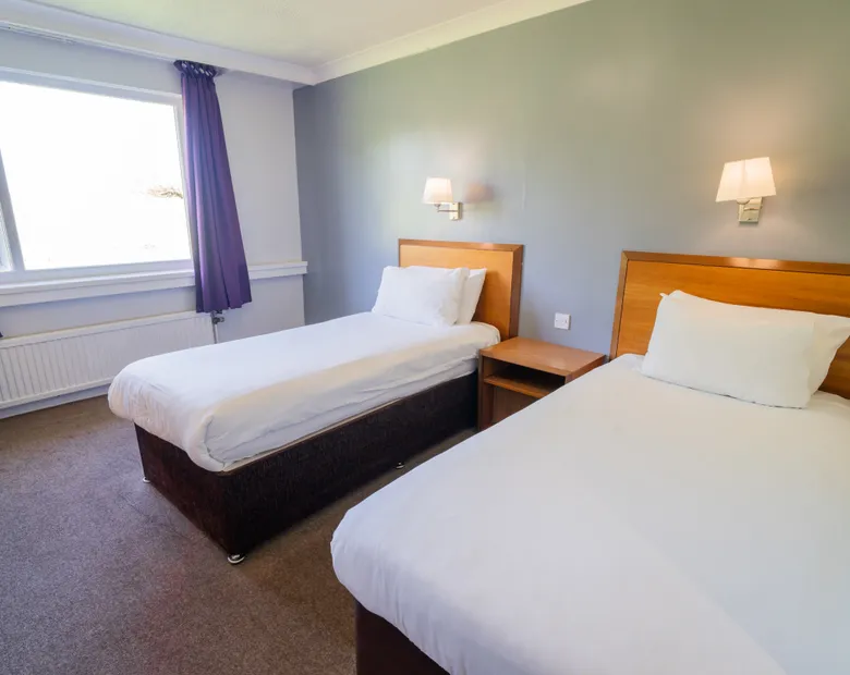 Twin bedroom with two single beds at Sporting Lodge Inns Middlesbrough