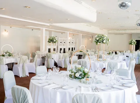 Wedding breakfast tables set up at Sporting Lodge Inns